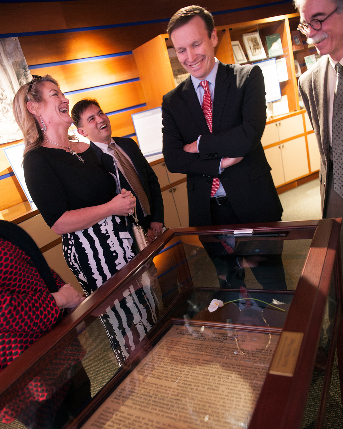 U.S. Senator Chris Murphy views an exhibition in the Lender Family Special Collection Room on the Mount Carmel Campus